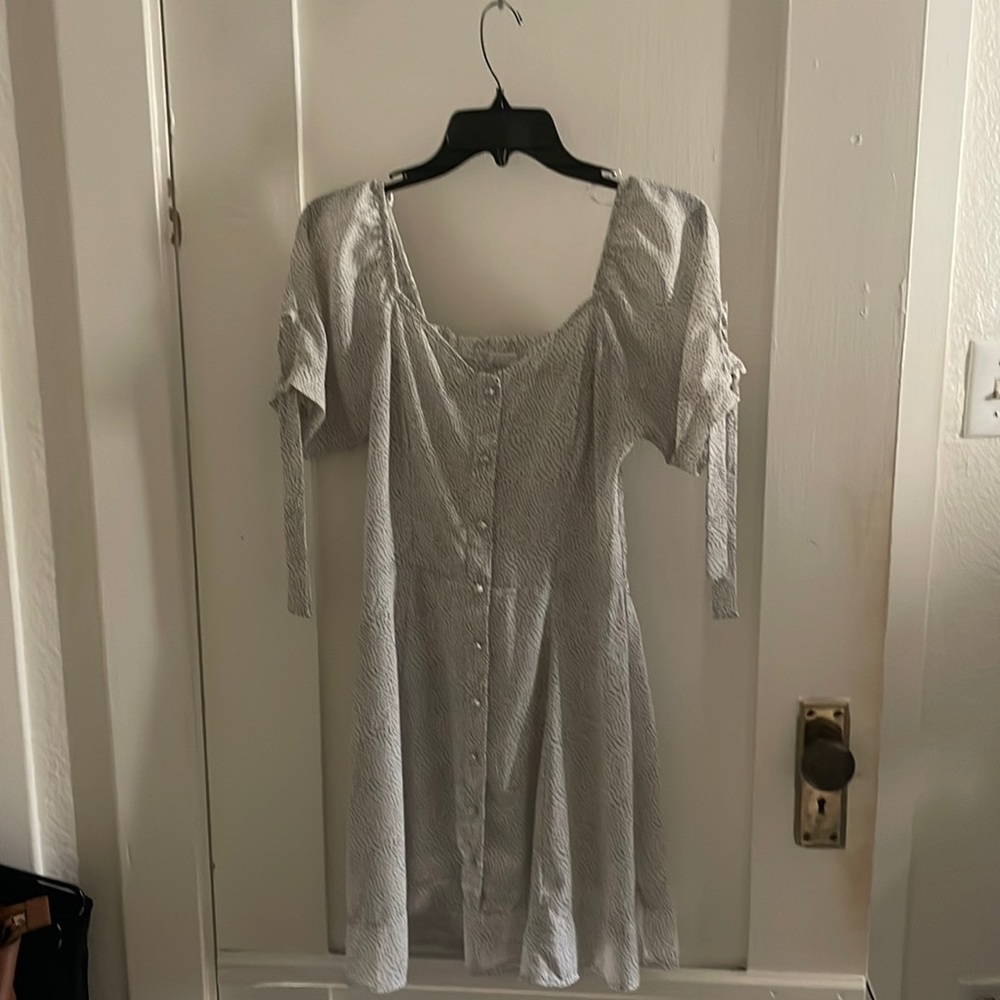 White and black polka dot mini dress.